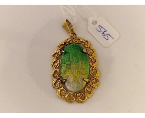 A gold filled green and white enamel art nouveau pendant signed by French Limoges artist CAMILLE FAVRE