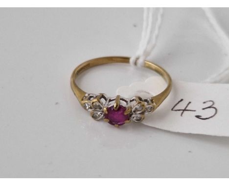 A attractive ruby and diamond ring 9ct size M