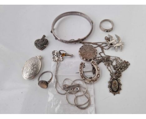 A bag of assorted silver jewellery inc. bangles locket rings etc. 55 gms