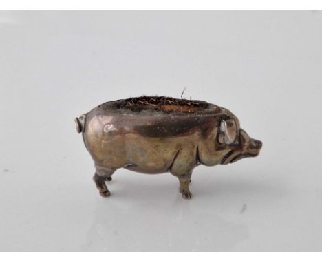 Pin cushion in form of a standing pig and marked rubbed