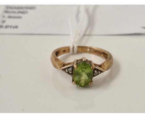 A peridot and diamond ring 9ct size O 3.1 gms