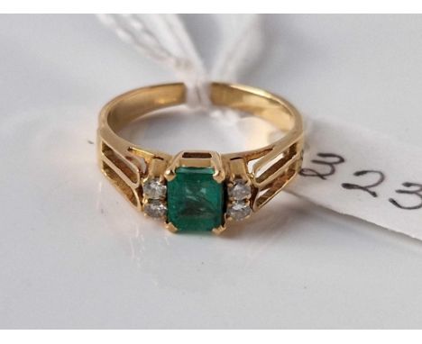 A emerald and diamond ring set in gold size I 2.8 gms