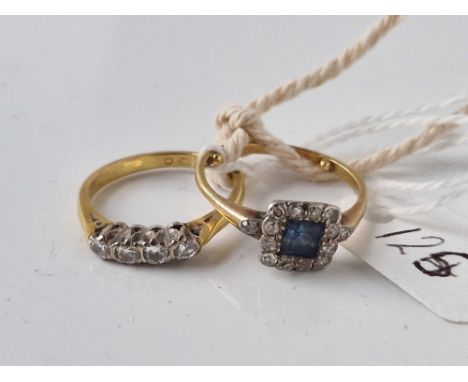 A SAPPHIRE AND DIAMOND RING SIZE N AND A FOUR STONE DIAMOND RING SIZE M BOTH 18CT GOLD  5.5 GMS INC.