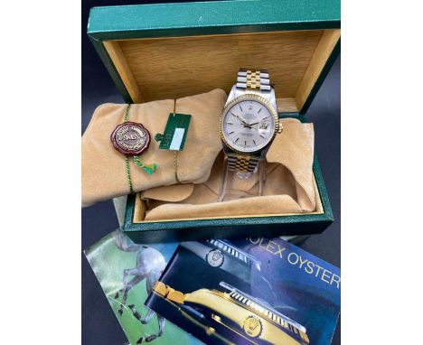 A BI METAL ROLEX OYSTER PERPETUAL WRIST WATCH WITH SECONDS SWEEP AND DATE APERTURE ON ORIGINAL STRAP AND TWO SPARE LINKS ALL 