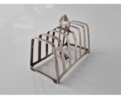 Seven bar toast rack on bracket feet 5 in long. Birmingham 1936. 121gms