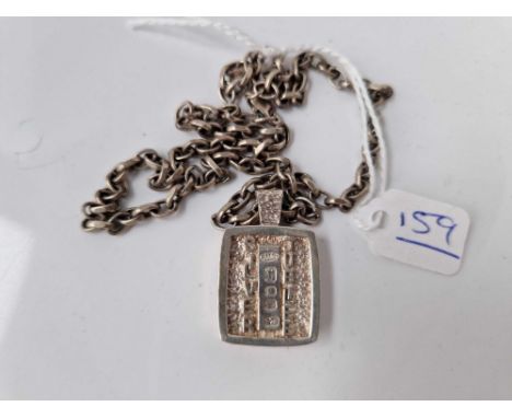 A chunky heavy silver Jubilee pendant ingot necklace