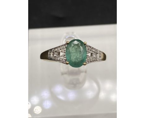 A attractive emerald and diamond ring 10ct gold size S 2 gms