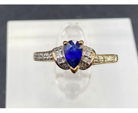 A sapphire and diamond dress ring with diamond shoulders Size N 9ct