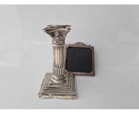 A square photo frame with ribbon tie, 2.5" high, Birmingham 1916 &amp; a square based candlestick, 4" high