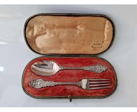 A good quality Christening spoon &amp; fork with cast decoration, London 1893 by WC, JL, 86g, boxed