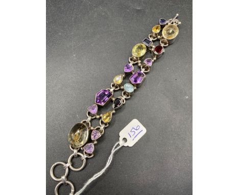 A Large Silver Multi Stone Bracelet set with amethyst garnets a d citrines etc. 8 inch 69 gms