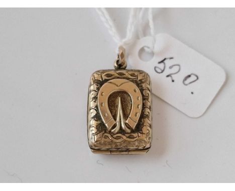 A antique back and front locket with horse shoe