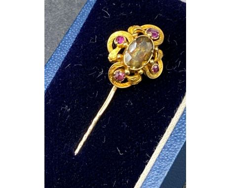 A Georgian ruby and topaz stick pin 18ct gold tested boxed