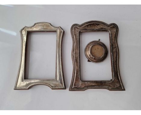 Two arch top photo frames, 7" high an a third circular example