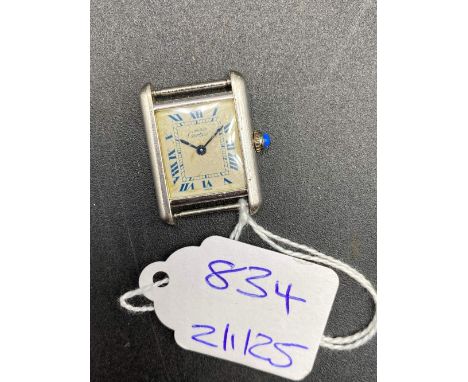 A UNUSUAL CARTIER TANK QUARTZ WRIST WATCH