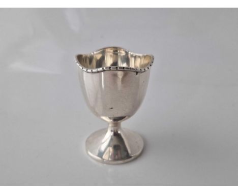 Good eggcup with wavy band and pedestal  base. Birmingham 1946. 19gms