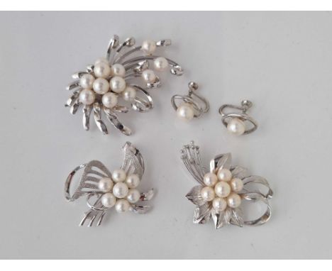 Three silver and pearl brooches with earrings 49 gms