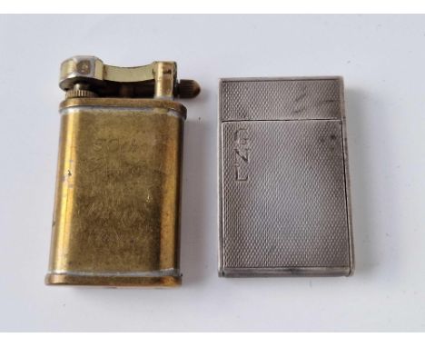 A silver lighter together with a brass example