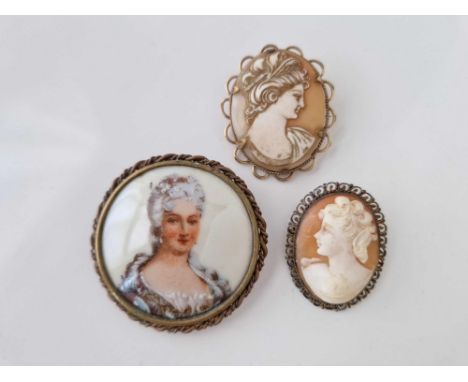 Two cameo brooches and a limoges brooch