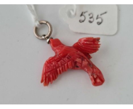 A antique carved coral bird pendant