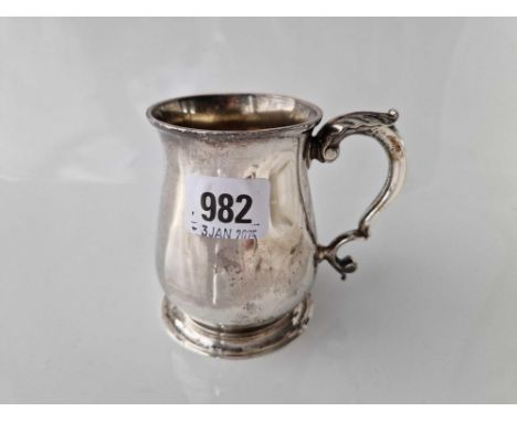 George II half pint tankard with leaf capped handle and spreading foot. London 1746. Script JC?. 195Gms