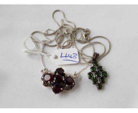 A Sterling silver and garnet opening clasp necklace together with a Sterling silver and green stone necklace