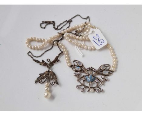 A attractive silver and seed pearl moon stone butterfly necklace together with a silver and marcasite necklace