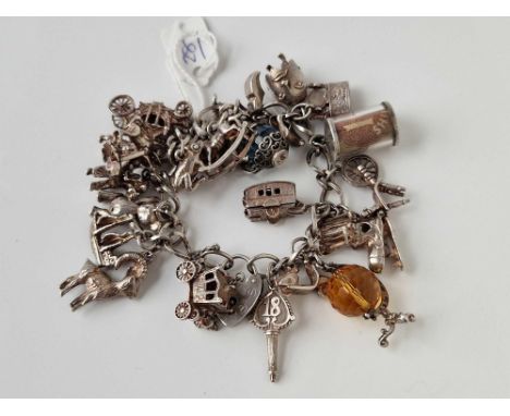 A silver charm bracelet 7 inch 92 gms