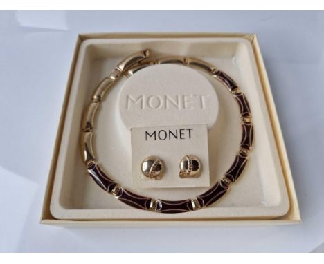 A MONET gold tone necklace and earrings set boxed