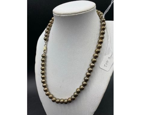 A silver bead necklace on silver wire 16 inch