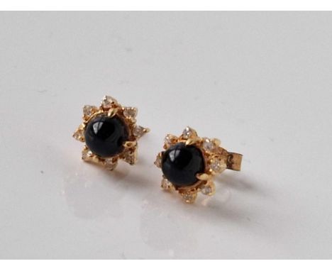 A pair of gold and blue stone and diamond ear studs 1.7 gms