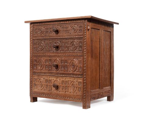 A 1930's Robert ''Mouseman'' Thompson Panelled Oak Chest of Drawers, the rectangular overhanging top above four graduating dr