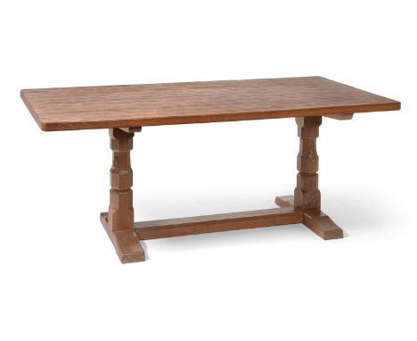 A Robert ''Mouseman'' Thompson Oak 6' Refectory Table, on two octagonal legs joined by a stretcher at floor level, with carve