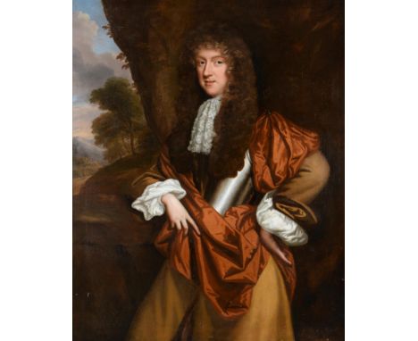 Attributed to John Riley (1646-1691) Portrait of a gentleman, three quarter length, standing before a landscape wearing a yel