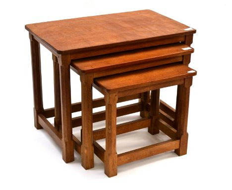 A Robert ''Mouseman'' Thompson Oak Nest-of-Tables, on four octagonal legs, each with carved mouse signature, the largest 61cm