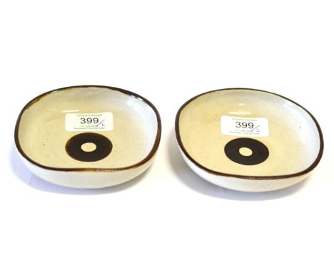 Dame Lucie Rie (1902-1995): A Pair of Stoneware Dishes, of square form, pitted oatmeal glaze with circular brushwork centre, 