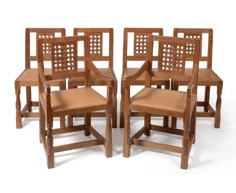 A Set of Six (4+2) Robert ''Mouseman'' Thompson Oak Lattice Back Dining Chairs, with cow hide upholstered seats, on two octag