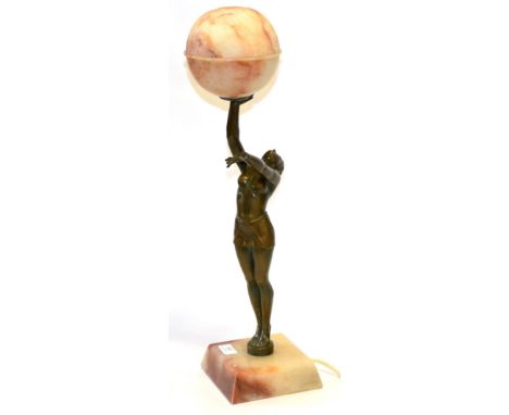 A 1930's Art Deco Spelter Lamp, in the form of a female athlete holding aloft a two piece prize alabaster global shade, squar