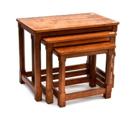 A Robert ''Mouseman'' Thompson Oak Nest-of-Tables, on four octagonal legs, each with carved mouse signature, the largest 61cm