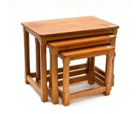 A Robert ''Mouseman'' Thompson Oak Nest-of-Tables, on four octagonal legs, each with carved mouse signature, the largest 61cm