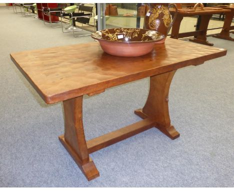 A Robert ''Mouseman'' Thompson Oak 4'3'' Refectory/Pub Table, on two octagonal legs joined by a floor stretcher, with carved 