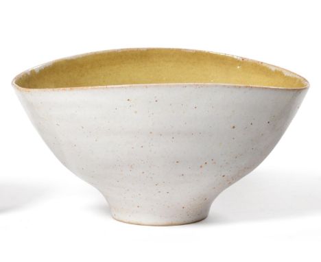 Dame Lucie Rie (1902-1995) and Hans Coper (1920-1981): A Stoneware Bowl, of elliptical form, pitted oatmeal glaze to exterior