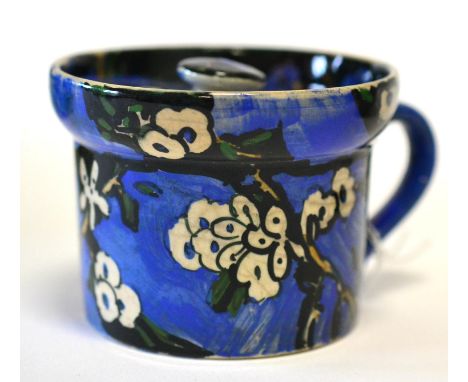 Jessie Marion King (1875-1949): An Earthenware Preserve Jar and Cover, painted with white blossom on a blue ground, painted m