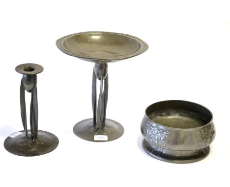 A Liberty & Co Pewter Tazza, designed by Archibald Knox, the shallow bowl with honesty rim, on a tripartite support and domed