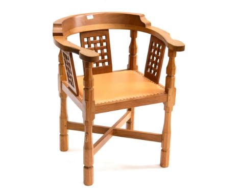 A Robert ''Mouseman'' Thompson Oak Monk's Chair, with curved back and shaped arms, over three lattice panels, tan hide seat, 