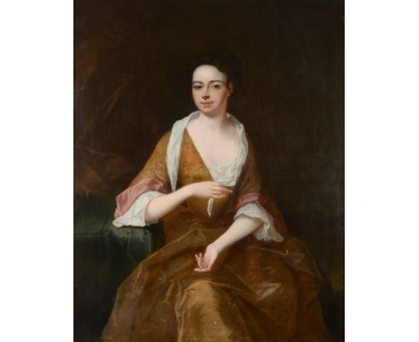 Circle of John Riley (1646-1691) Portrait of a lady, reputedly Lady Nightingale, three quarter length, seated, wearing an ora