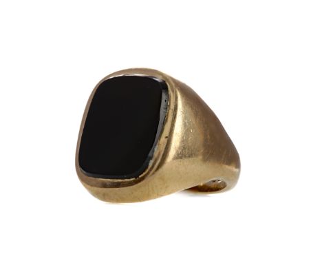 BLACK HARDSTONE SIGNET RING, set with a cushion shaped section of hardstone, in nine carat gold, size N, 9.7g