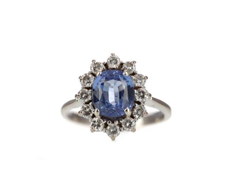 SAPPHIRE AND DIAMOND RING, set with a cushion shaped sapphire of approximately 2.12 carats, within a halo of round brilliant 