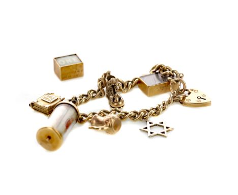 CHARM BRACELET, of curb link form, unmarked, with charms including a teapot and a metal star of David, with nine carat gold h