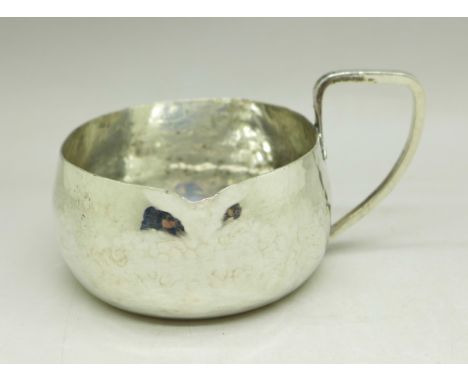 A hammered silver Arts and Crafts jug, Chester 1904, Haseler Brothers, 53g 
